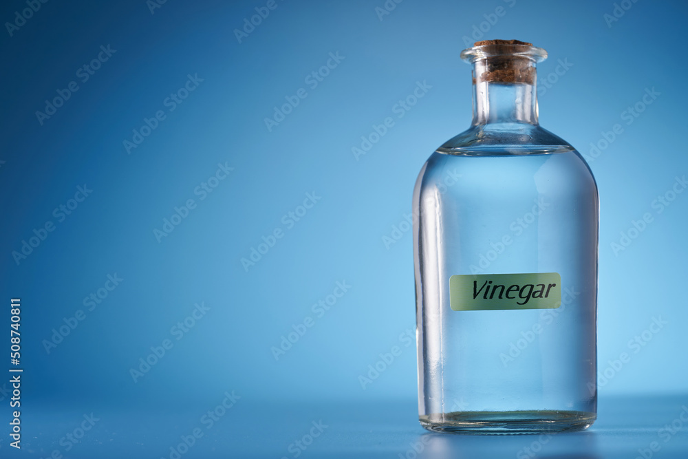 white vinegar against blue background