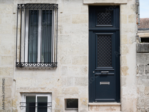 modern wooden front door of new restored house entrance dark classic gate