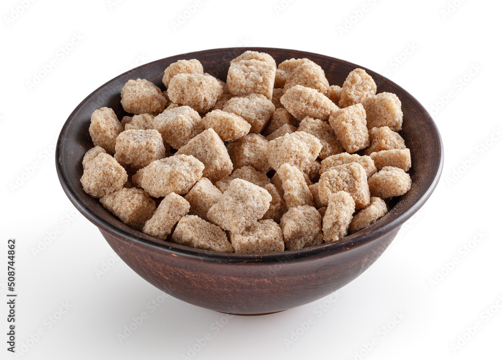 Cubes of brown cane sugar in ceramic bowl isolated on white background with clipping path Cubes of brown cane sugar in ceramic bowl isolated on white background with clipping path