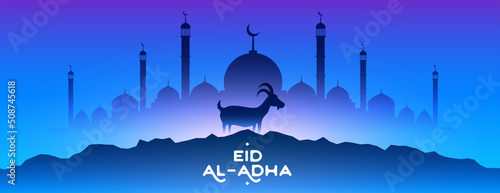 eid al adha mubarak with mosque and goat blue background photo