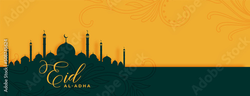 eid al adha mubarak with mosque and arabic floral design banner