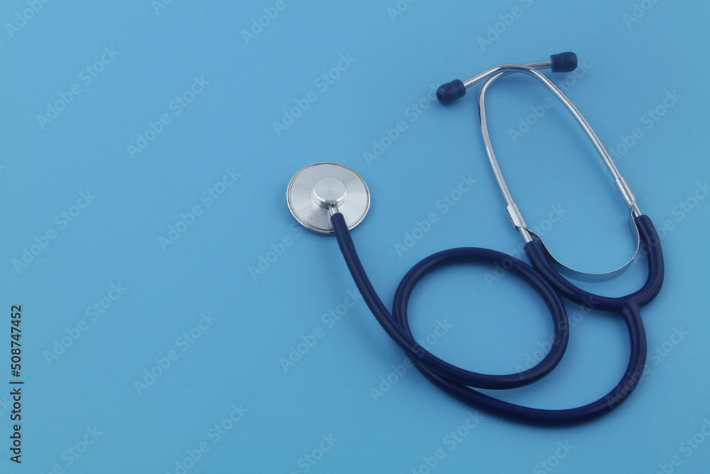 Stethoscope on blue background, copy space for text. Symbol of medicine and medical exam. Stethoscope on blue background, copy space for text. Symbol of medicine and medical exam.