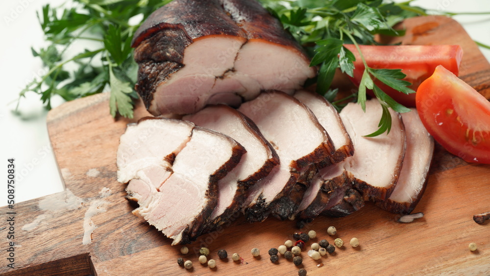 Smoked pork belly , cured bacon with sliced strip and spices on wooden cutting board Smoked pork belly , cured bacon with sliced strip and spices on wooden cutting board