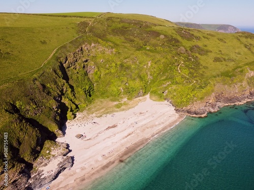 Aerial view of the stunning coastline and beach at Lantic Bay. Crystal clear turquoise sea water in Cornwall, England. photo