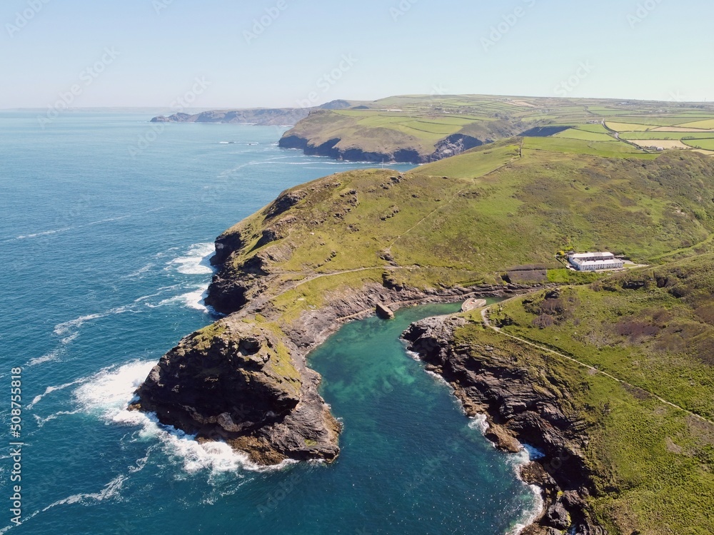 Aerial drone shot of Boscastle, harbour and its rugged coastline. Picturesque seaside village in Cornwall, England.