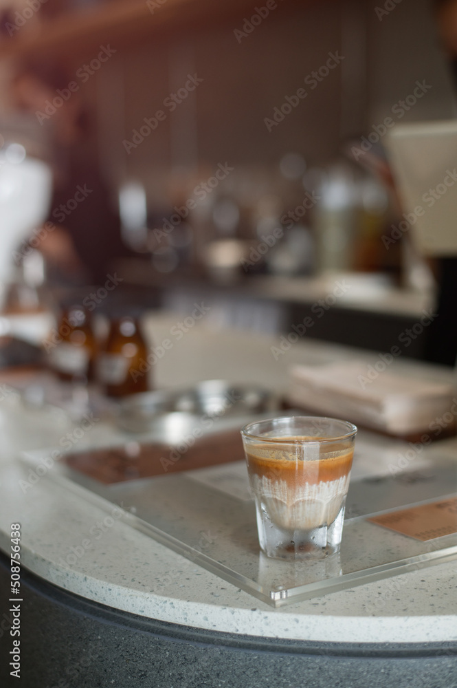 hot coffee on a table with cream being poured into it showing the texture hot coffee on a table with cream being poured into it showing the texture