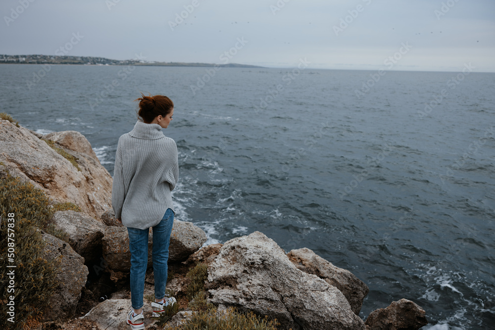 woman sweaters cloudy sea admiring nature unaltered