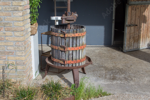 Ταπετσαρία Image of an old wine press for wine production.