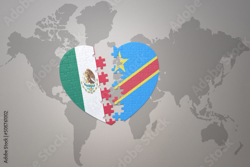 puzzle heart with the national flag of democratic republic of the congo and mexico on a world map background.Concept.