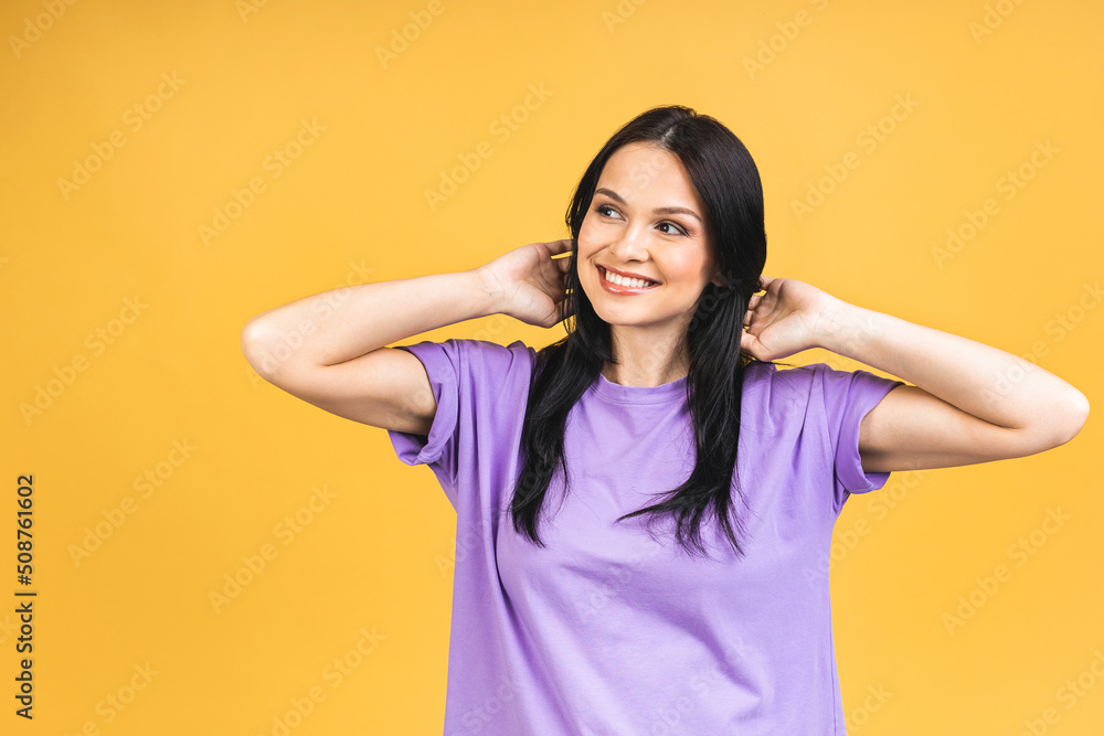 Portrait of happy smiling brunette girl in casual isolated over yellow background. Portrait of happy smiling brunette girl in casual isolated over yellow background.