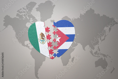 puzzle heart with the national flag of cuba and mexico on a world map background.Concept.