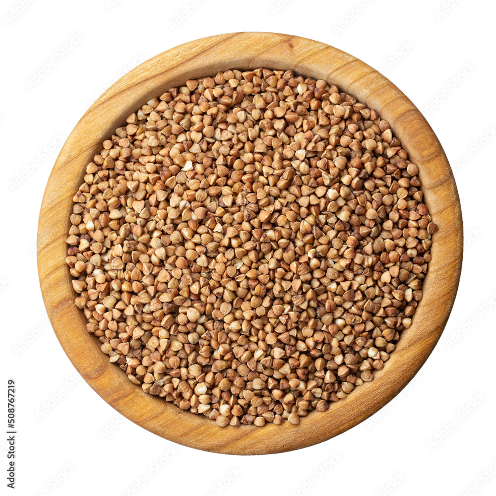 Buckwheat in a wooden bowl isolated on white. Top view. Buckwheat in a wooden bowl isolated on white. Top view.