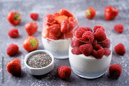 Greek yogurt Chia seeds strawberry and raspberry parfait in a glass