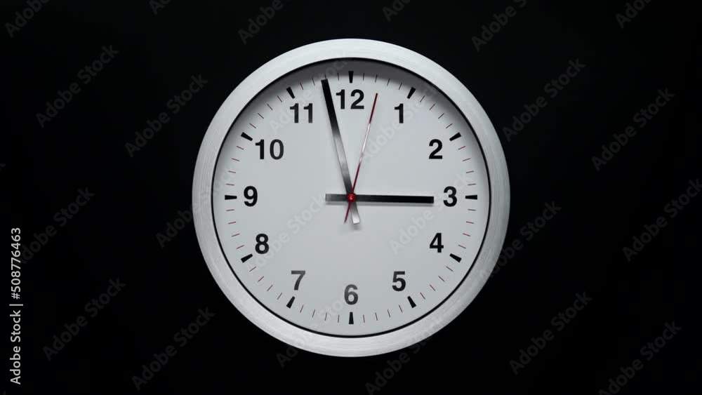 Grey Wall Clock With A Black Arrows And Red Second Hand On Black Background. Wall Clock Face Of Time Of 3.00 Am Or Pm. 4k. ProRes. Timelapse. Grey Wall Clock With A Black Arrows And Red Second Hand On Black Background. Wall Clock Face Of Time Of 3.00 Am Or Pm. 4k. ProRes. Timelapse.