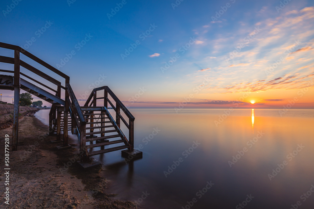 Sunrise over the pier in Mecheliki