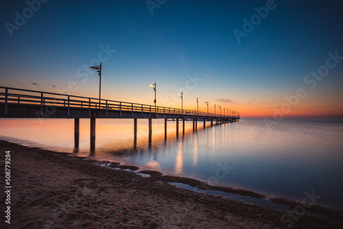 Sunrise over the pier in Mecheliki © R_Szatkowski