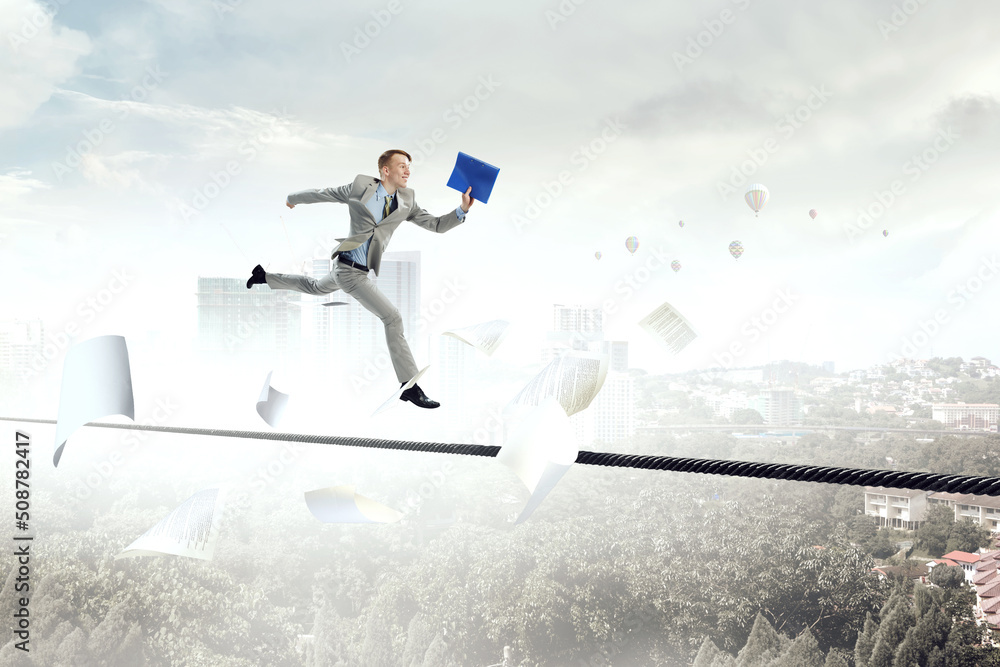 Portrait of energetic businessman jumping in open air Portrait of energetic businessman jumping in open air