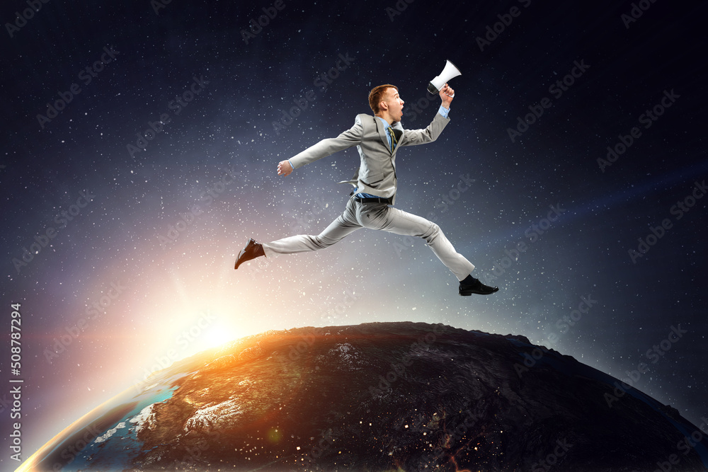 Portrait of energetic businessman jumping in open air Portrait of energetic businessman jumping in open air