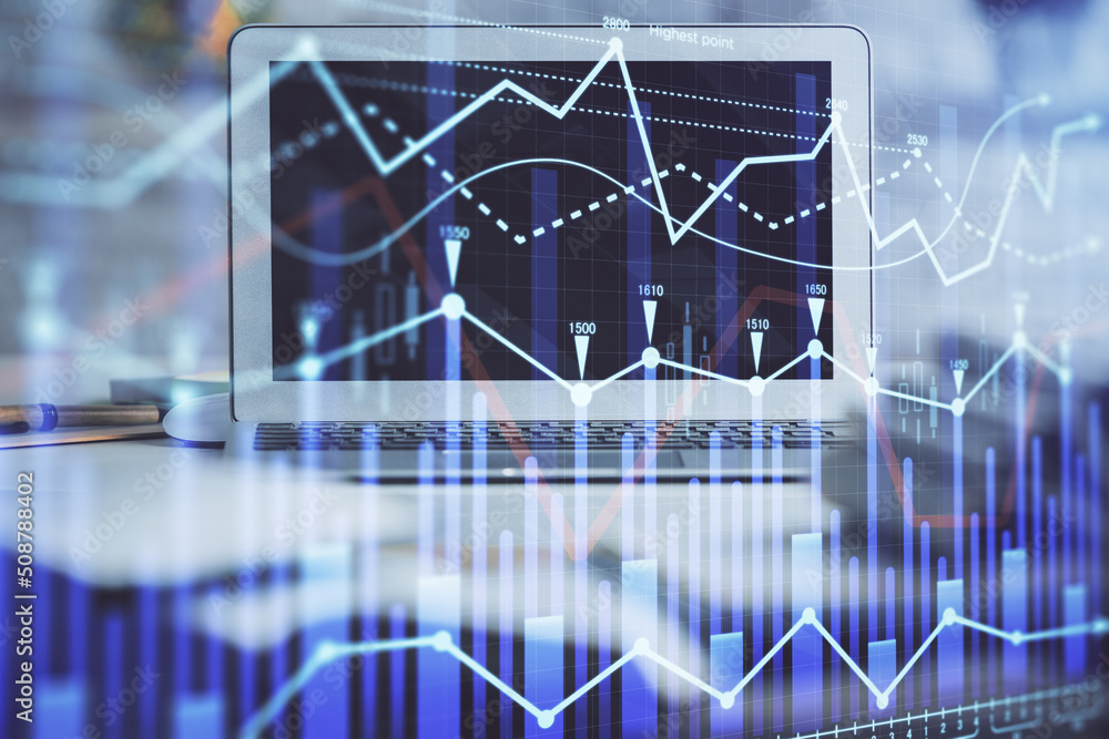 Forex market graph hologram and personal computer on background. Double exposure. Concept of investment. Forex market graph hologram and personal computer on background. Double exposure. Concept of investment.