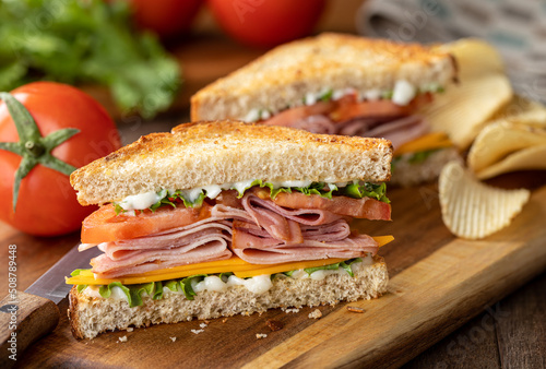 Ham sandwich with cheese, lettuce and tomato