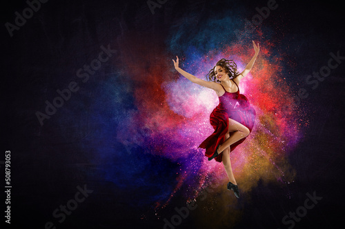 Fototapeta Naklejka Na Ścianę i Meble -  Female dancer against abstract colourful background