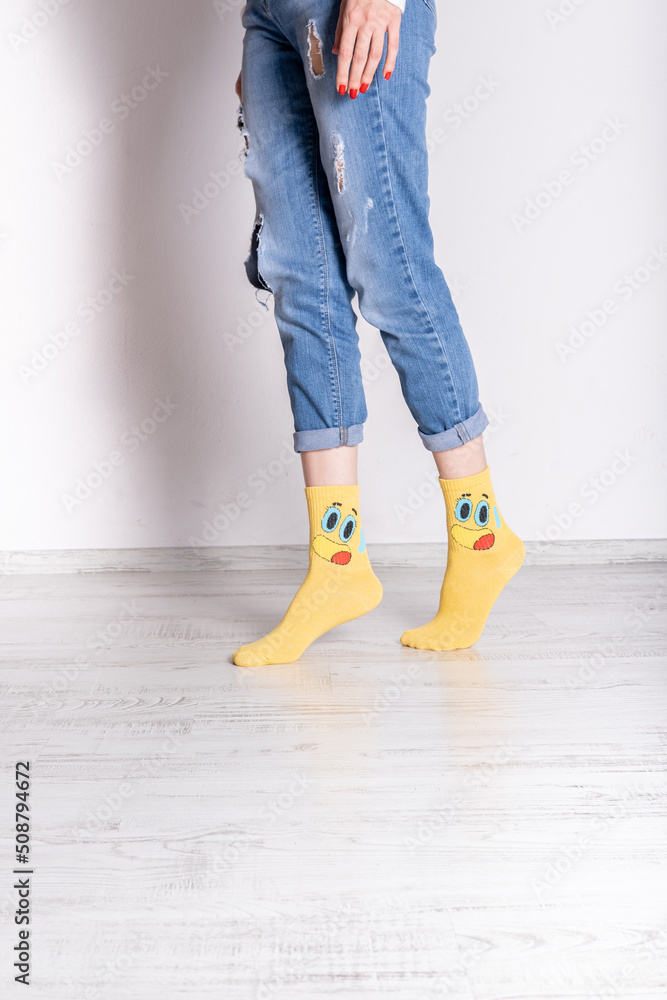 yellow and smiling women socks. Image of women socks. Image of woman in blue jeans and socks. yellow and smiling women socks. Image of women socks. Image of woman in blue jeans and socks.