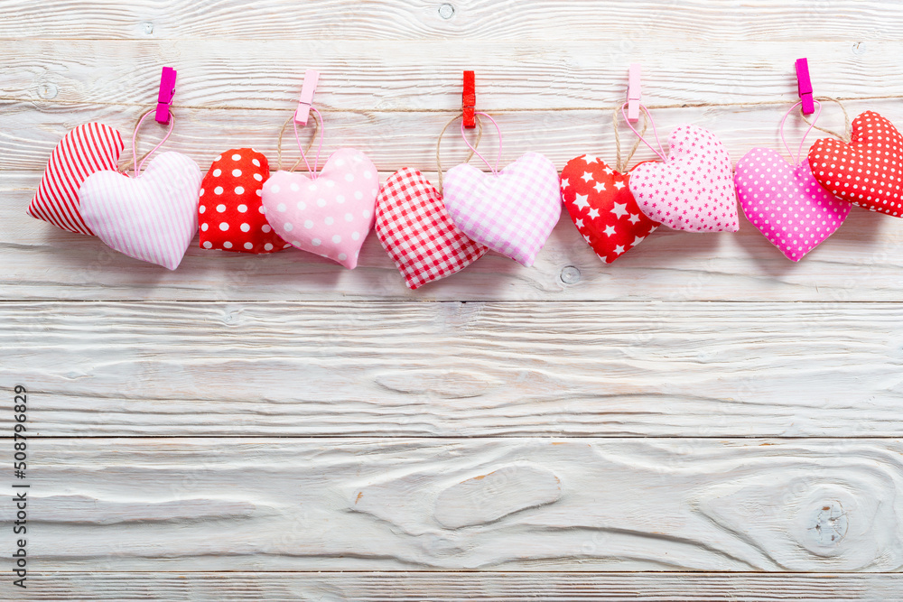 Fabric sewed hearts on a clothesline flat lay