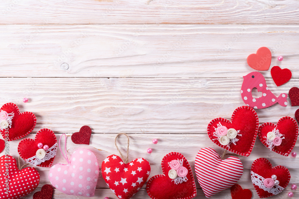 Valentine handmade heart flat lay background on white wooden table