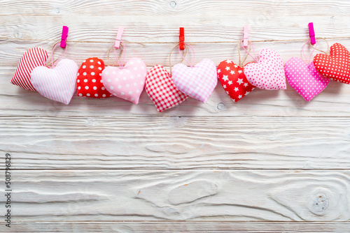 Fabric sewed hearts on a clothesline flat lay