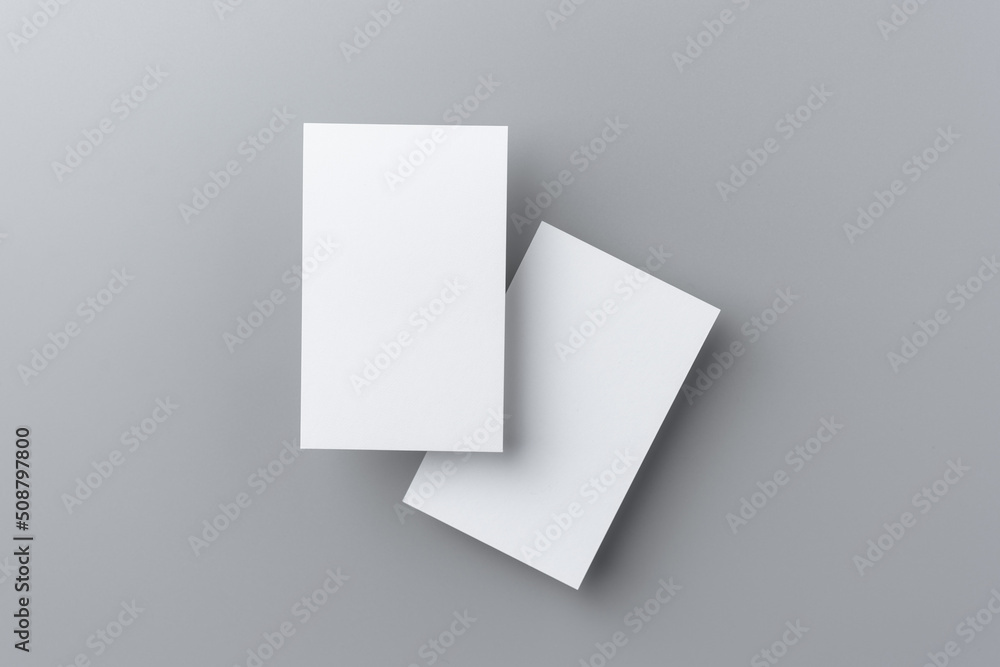 two business card isolated on grey background two business card isolated on grey background