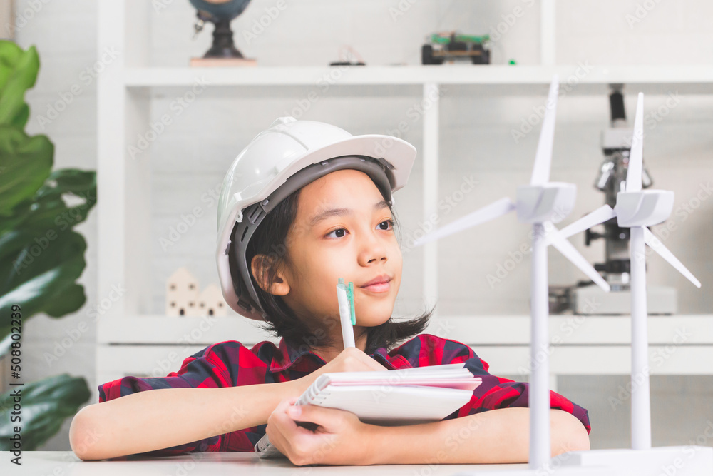 Kid learning about renewable energy, Child girl how wind turbines work Kid learning about renewable energy, Child girl how wind turbines work