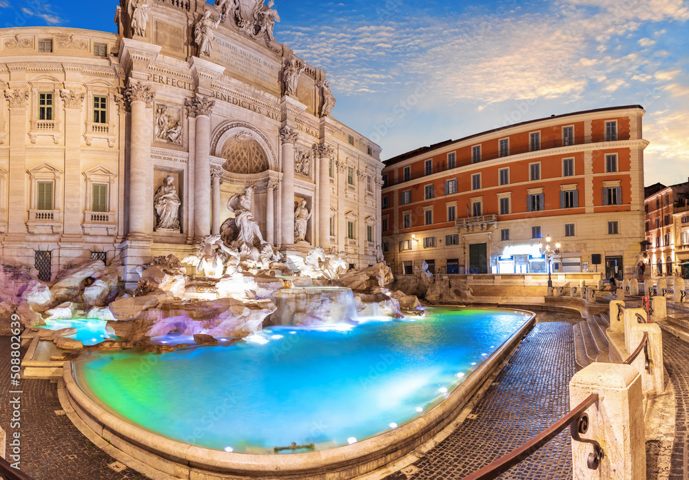 Trevi Fountain and its beautiful statues at sunset, a famous italian sight, Rome