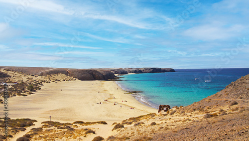 Beautiful large wide secluded idyllic empty sand beach lagoon, turquoise sea, dry hills dunes, rocks - Playa Mujeres, Ponte Papagayo, Playa Blanca - Lanzarote