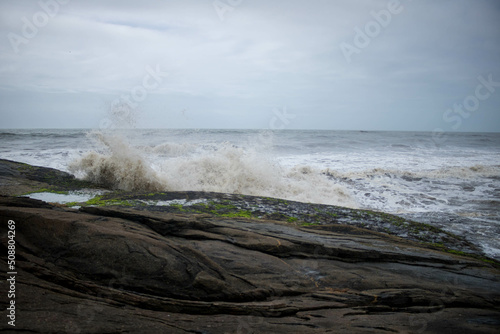 View of the orizonte at guaratuba beach, parana, brazil showing the sea and the rocks photo