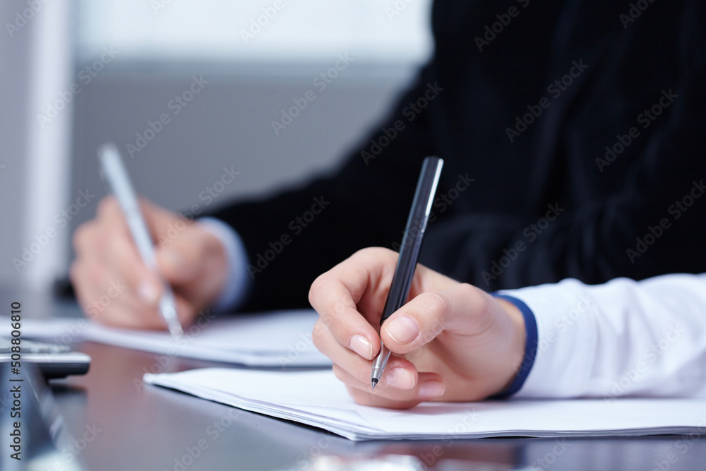 man and woman hands signing contract paper in office man and woman hands signing contract paper in office