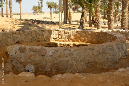 Prophet Moses Springs, Water wells and palms in Sinai Peninsula, Ras Sidr, Egypt, The Springs of Moses are a group of hot springs forming a small fertile oasis in the middle of Sinai desert photo