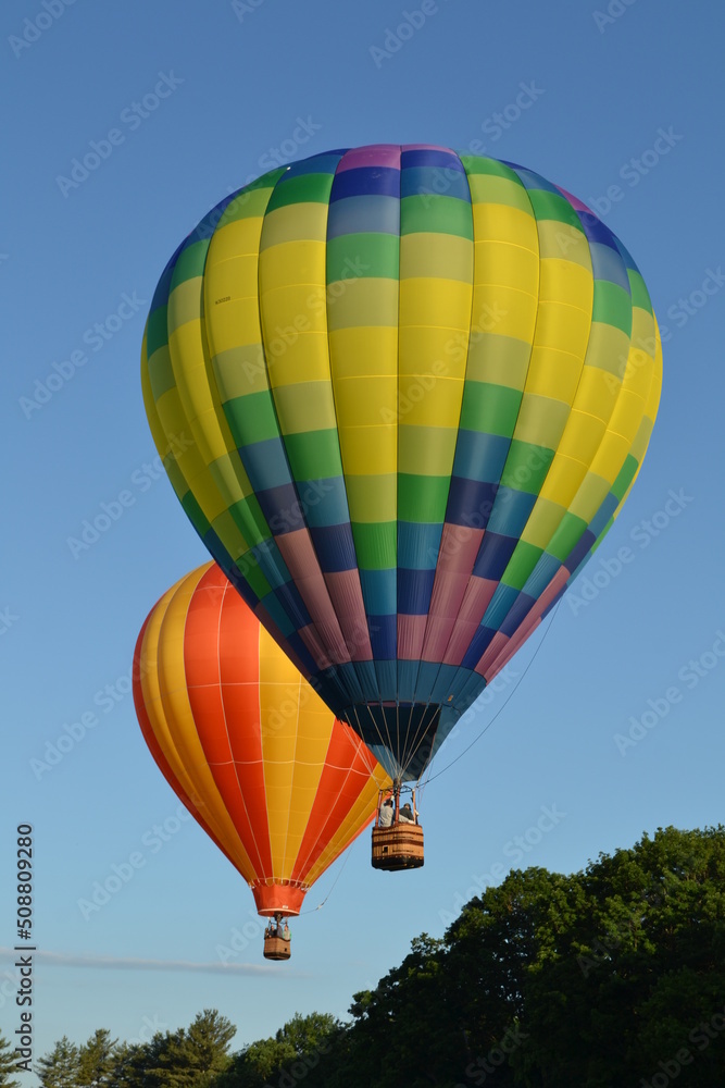 Fototapeta premium Colorful hot air balloons launching into the sky