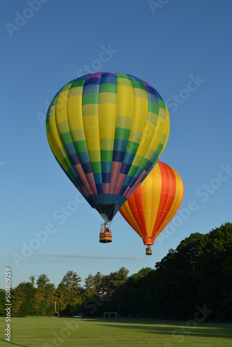 Colorful hot air balloons launching into the sky © Jenette