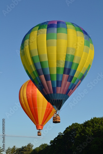 Colorful hot air balloons launching into the sky © Jenette