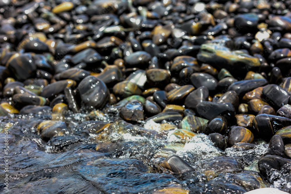 Absract black pebble on the beach for nature background. Absract black pebble on the beach for nature background.