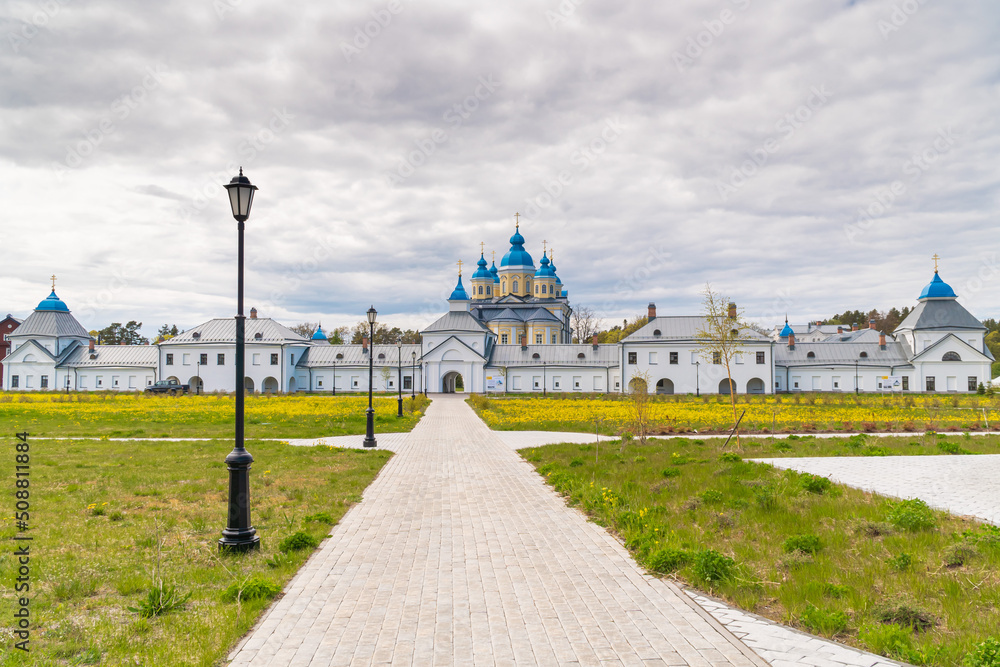 Russia. Leningrad region. May 29, 2022. View of the Nativity of the Theotokos Monastery from the territory of Konevets Island.