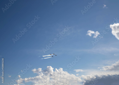 Four small planes flying across the blue sky place for text template