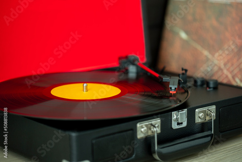 A retro-styled spinning record vinyl player.