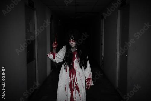 Portrait of asian woman make up ghost,Scary horror scene for background,Halloween festival concept,Ghost movies poster,angry spirit in the apartment