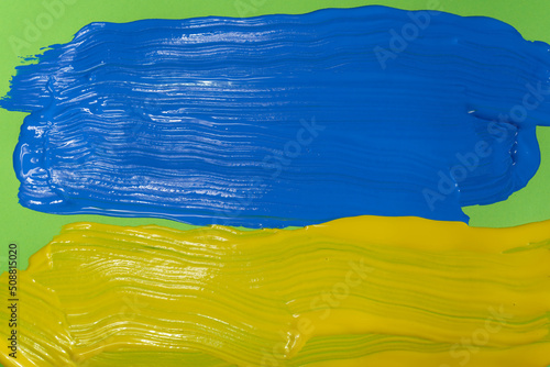 Yellow and Blue brush strokes  on green background.   .Reflecting the Ukraine national colors.    .Abstract image of yellow and blue brush strokes on greeen background