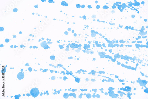 Drops of watercolor on white background