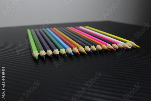 Color pencils on table with white background