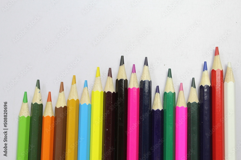 Color pencils on black table sheet Color pencils on black table sheet