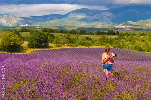 Woman take photo on lavender field, Provence France