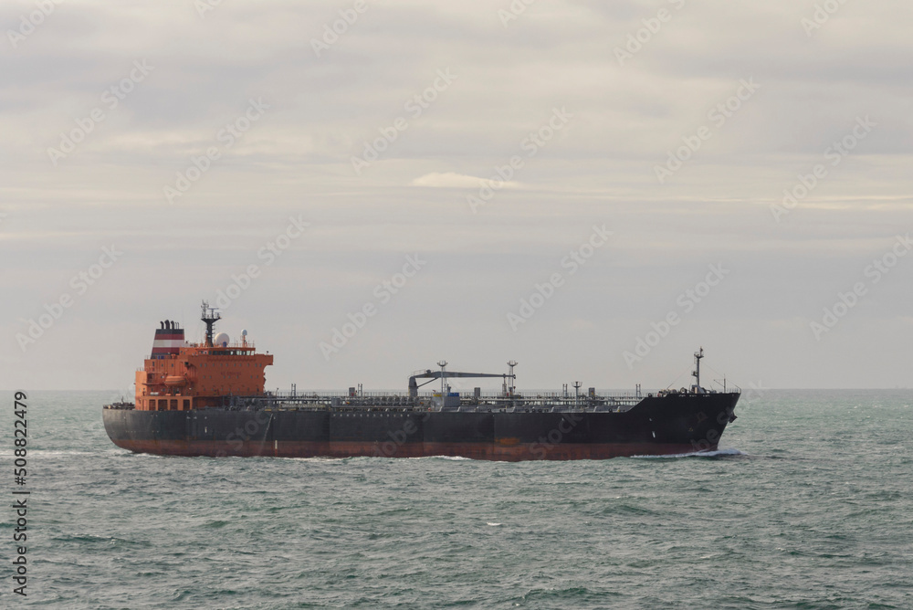 Tanker. Cargo vessel at sea. Beautifil light.